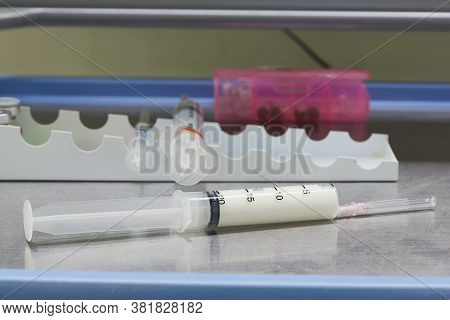 A White Anesthetic Drug In Syringe On The Table In Operating Room