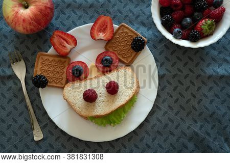 Cute Cow Shaped Sandwich With Cheese And Berries Served With Apple And Berries. Top View. Kid Food