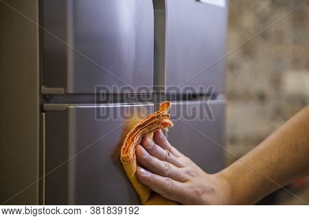 Cleaning The Refrigerator Against Coronavirus During Pandemic In Quarantine