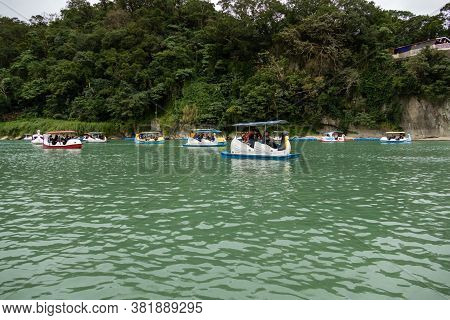 Unidentified People Enjoying Pedal Boats At Bitan Scenic Area