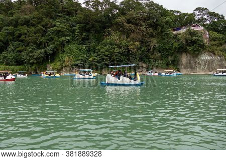 Unidentified People Enjoying Pedal Boats At Bitan Scenic Area