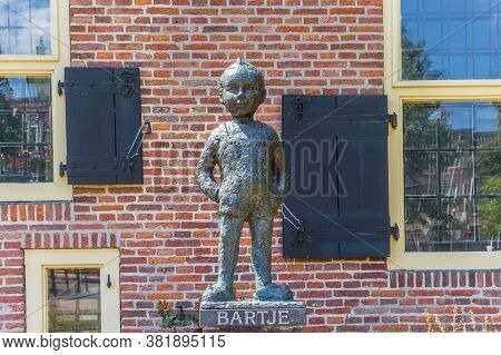 Assen, Netherlands - May 30, 2020: Statue Of Little Boy Bartje In Assen, Netherlands