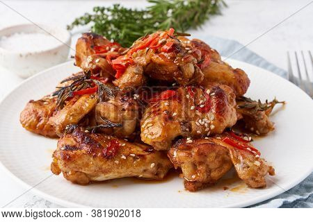 Barbecue Chicken Wings. Oven Baked Chiken On Plate. Hot Korean Food. Side View, Close Up
