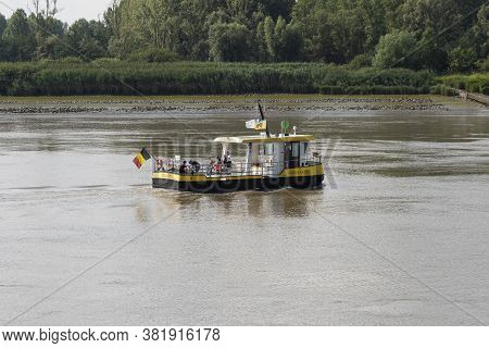 Tielrode, Belgium, 02 August 2020, The Ferry With People On Board On The Durme River