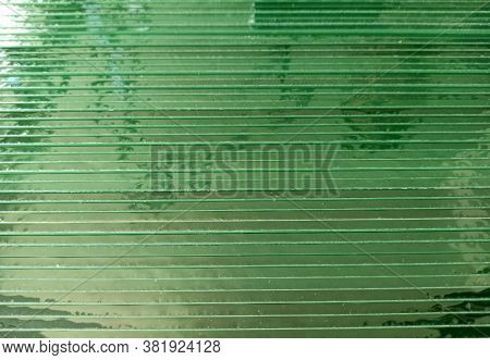 Glass Sheets In Horizontal Position. Texture Of Green Glass Sheets. Transparent Background From Butt