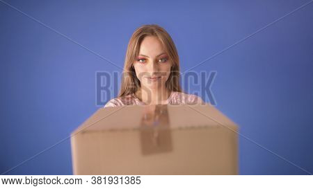 Young Caucasian Woman With Packed Cardboard Boxes And Surprised Face Isolated On The Blue Background