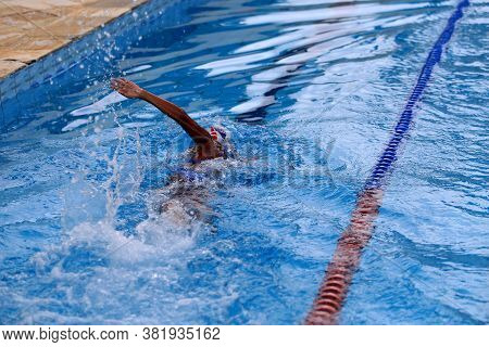 Salvador, Bahia / Brazil - April 10, 2019: Person Is Seen Swimming In Olympic Pool In The City Of Sa