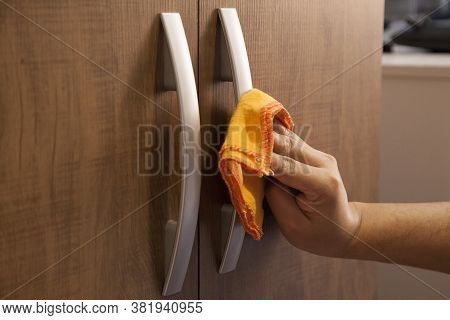Cleaning The Door Handle For Coronavirus Prevention During Normal New Quarantine