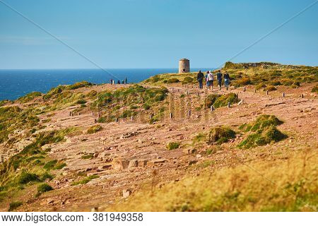 Scenic View Of Cape Frehel And Its Lighthouse, One Of The Most Popular Tourist Destinations In Britt