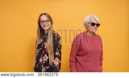 Trendy Senior Lady With Sunglasses And Young Woman Standing Next To Each Other. High Quality Photo