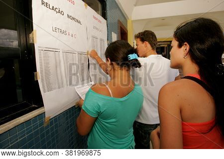 Eunapolis, Bahia / Brazil - November 6, 2010: People Look At Attendance List For Exams Of The Nation