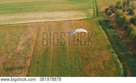 Paramotor Tandem Gliding And Flying In The Air. Copy Space. High Quality Photo