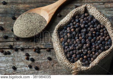 Heap Of Black Pepper And Black Pepper Powder, Milled Peppercorns On Wooden Background, Dried Spice P