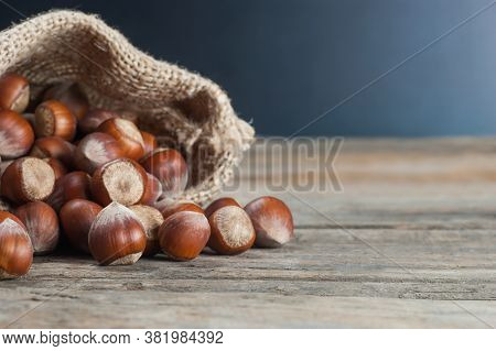 Hazelnuts, Filbert On Old Wooden Table. Heap Or Stack Of Hazel Nuts. Hazelnut Background, Healty Foo