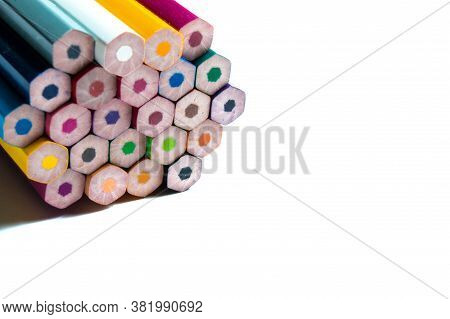 Unsharpened Multicolored Pencils On A White Background.