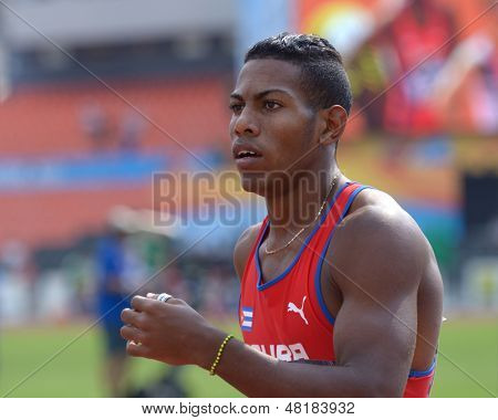 DONETSK, UKRAINE - JULY 14: Reynier Mena of Cuba waits for results of the final heat in 200 metres during 8th IAAF World Youth Championships in Donetsk, Ukraine on July 14, 2013