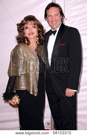 Joan Collins and Percy Gibson at the 2007 World Magic Awards to benefit Feed The Children. Barker Hangar, Santa Monica, CA. 10-13-07