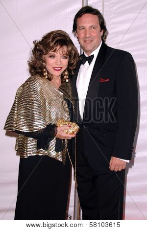 Joan Collins and Percy Gibson at the 2007 World Magic Awards to benefit Feed The Children. Barker Hangar, Santa Monica, CA. 10-13-07