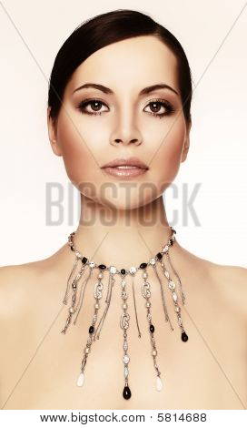 Young Woman With Necklace, Studio Shot Light Background
