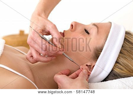 Alternative Practitioner Using Auriculotherapy Techniques.