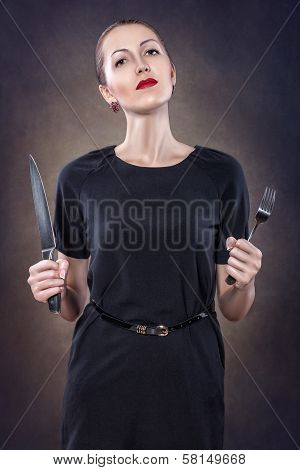 Girl With Red Lips With A Fork And Knife.