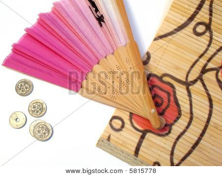 Japanese fan and coins
