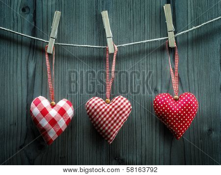 Valentine's Day wallpaper - Textile hearts hanging on the rope