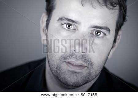 Close Up Shot Of A Handsome Deaf Male With Discreet Hearing Aid