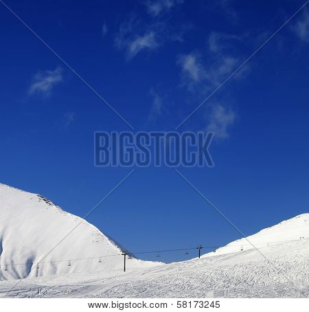 Ski Slope With Chair Lift At Sunny Winter Day
