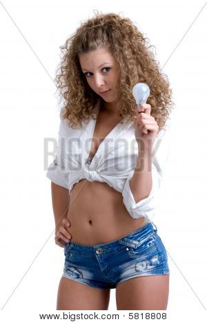 Beautiful curly girl with lamp