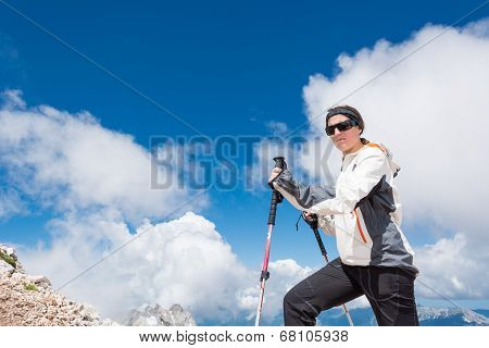 Young Woman Ascending A Mountain