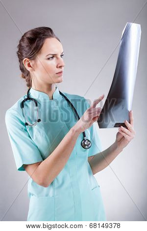 Doctor Analysing A Skiagraph