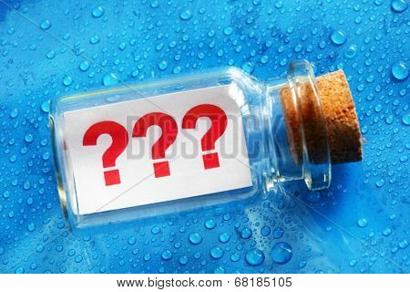 Question mark symbols message in a bottle concept for business confusion, problems and uncertainty