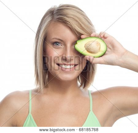portrait of attractive  caucasian smiling woman isolated on white studio shot eating avocado