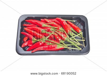 Heap Of Red Hot Chillie Pepper In Black Container Isolated On White Background.