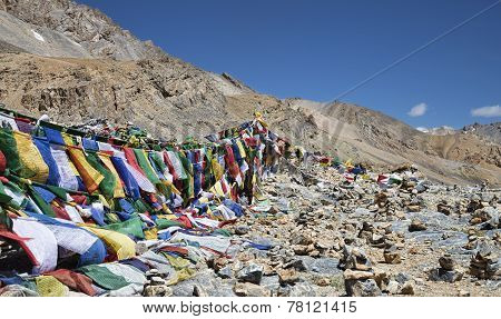Buddhist Prayer Flags And Stone Pyramids