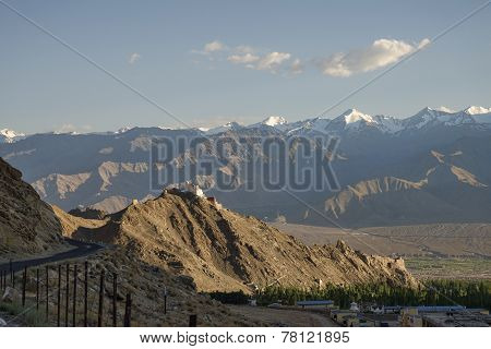 Ancient Casttle On Cliff Among High Mountains And Green Valley