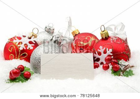Red,silver Christmas Decoration On Snow With White Wishes Card