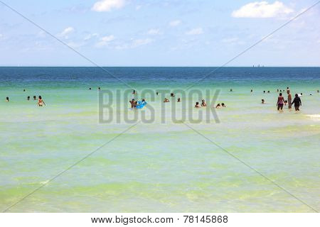 People Enyoy The Beach And Swimming In South Beach