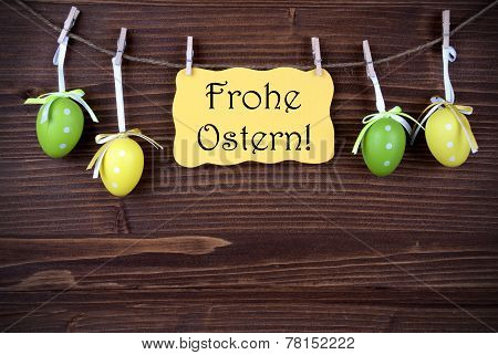 Yellow Label With Four Easter Eggs And Frohe Ostern