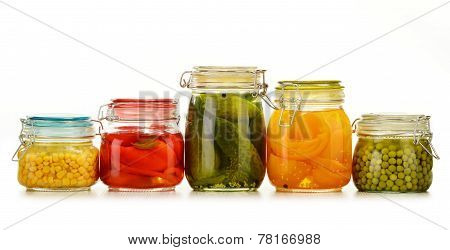 Jars With Pickled Vegetables And Fruity Compotes On White