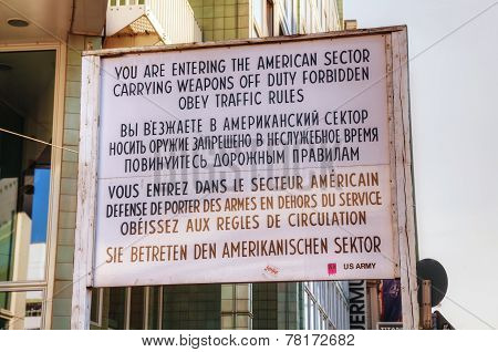 Historical Sign At Checkpoint Charlie In Berlin