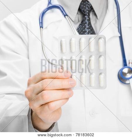 Doctor Holdling Pills In His Hand - Heath Care Concept