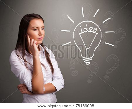Pretty young girl comming up with a light bubl idea sign