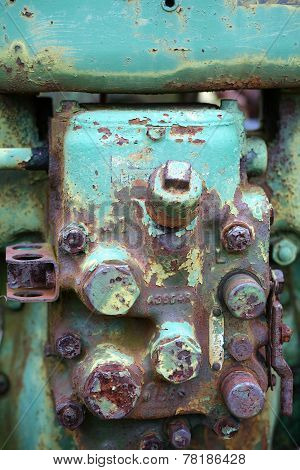 rusted tractor engine in field