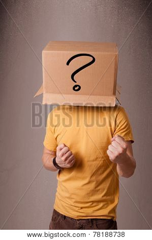 Young man standing and gesturing with a cardboard box on his head with question mark