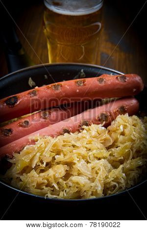 Bavarian Fried Sausages On Sauerkraut