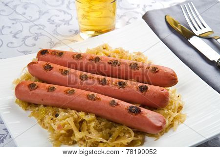 Bavarian Fried Sausages On Sauerkraut
