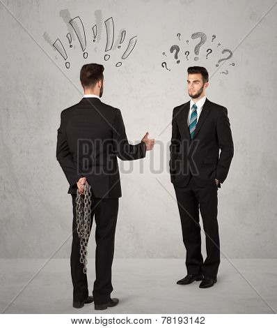 Ruthless businessman handshake with drawn exclamation and question marks around them head