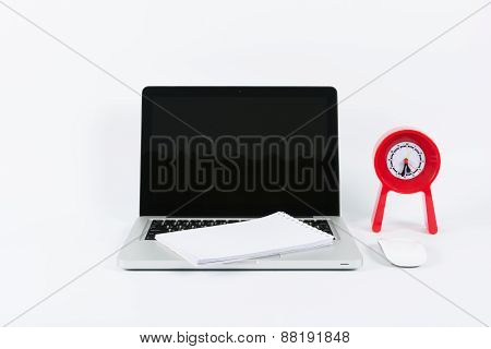Laptop And Red Clock  On  Isolate